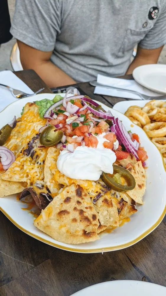 Nachos with Avocado Jalapeños Sour Cream
